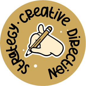 Icon representing creative direction and strategy with a hand holding a pencil, symbolizing the process of planning and designing creative projects.